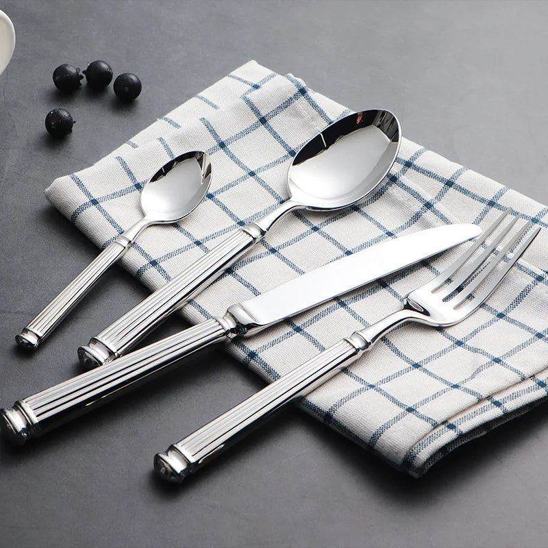 Luxury 18/10 Stainless Steel Cutlery Set. This exquisite set is designed for those who appreciate elegance and functionality in their tableware.  - Volaia